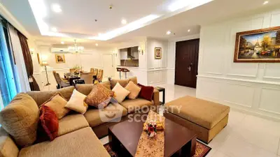 Luxurious living room with elegant decor and spacious seating area in a modern apartment.
