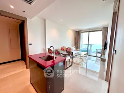 Modern open-plan living room with ocean view and stylish kitchen island.