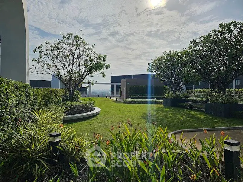 Luxurious garden view with lush greenery and ocean backdrop