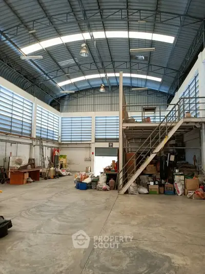 Spacious industrial warehouse with mezzanine and ample storage space