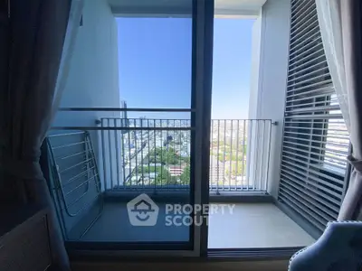 Modern apartment balcony with stunning city view and sleek design.