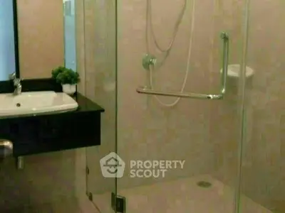 Modern bathroom with glass shower and sleek sink design