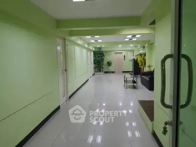 Spacious office corridor with modern design and bright lighting