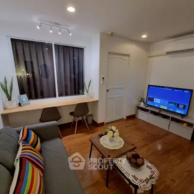 Cozy modern living room with stylish decor and entertainment setup
