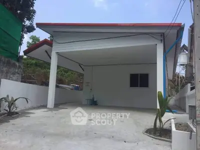 Modern carport with minimalist design and spacious driveway