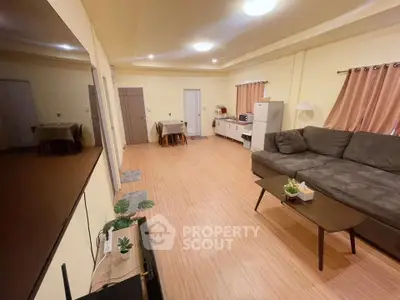 Spacious living room with modern decor and cozy seating area