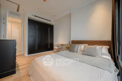 Modern bedroom with sleek design and ample natural light
