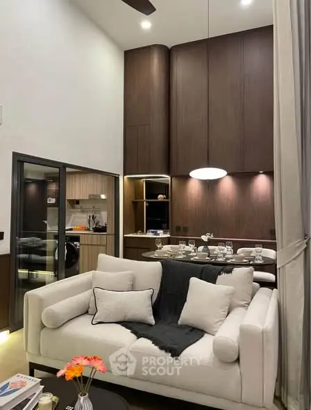 Luxurious living room with high ceiling and elegant decor