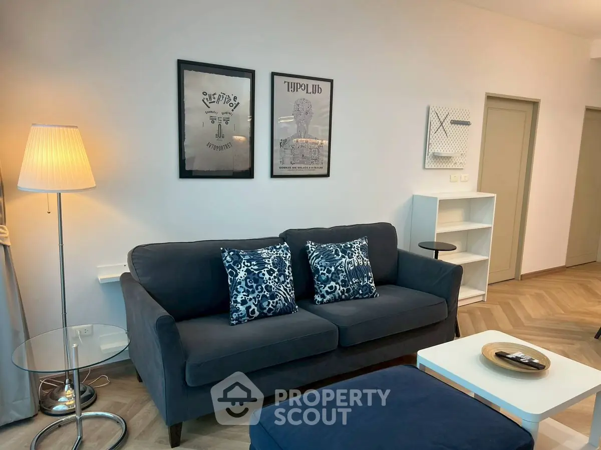 Stylish living room with modern decor and cozy seating in a contemporary apartment.