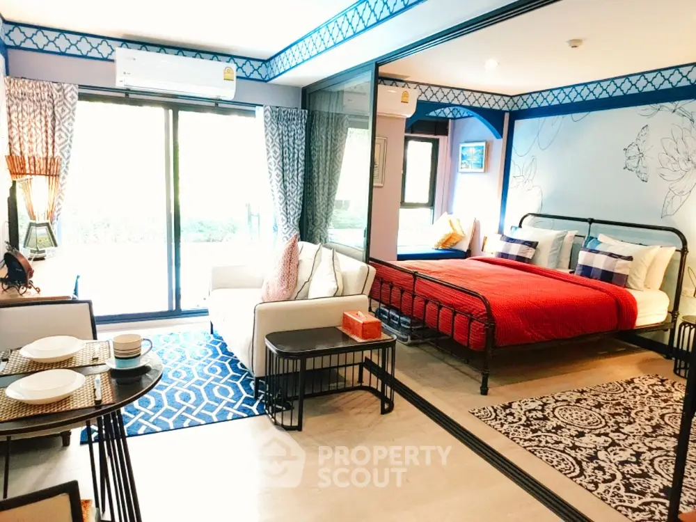 Chic studio apartment with modern decor, open layout, and vibrant colors