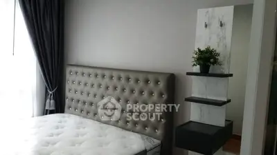 Luxurious bedroom with tufted headboard and elegant decor