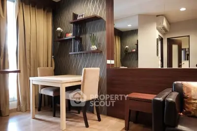 Stylish modern living room with elegant dining area and chic decor.