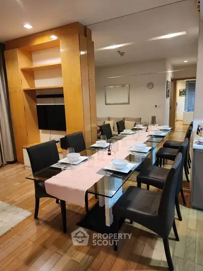 Elegant dining area with glass table and modern decor in a stylish apartment