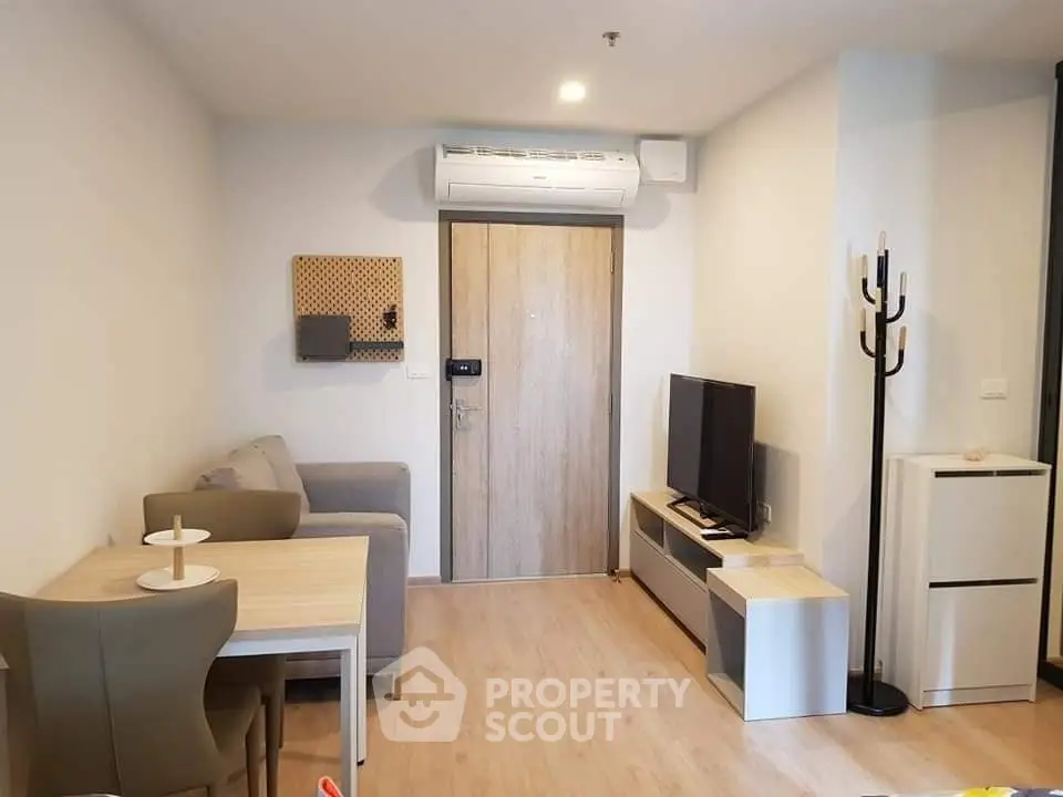 Modern living room with stylish furniture and air conditioning in a cozy apartment.