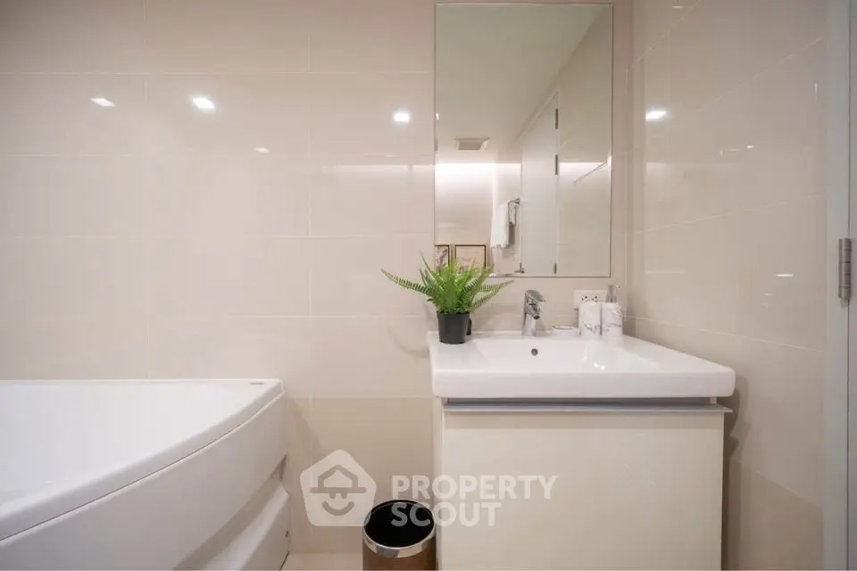 Modern bathroom with sleek fixtures and a stylish bathtub
