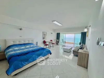 Spacious bedroom with ocean view and modern furnishings