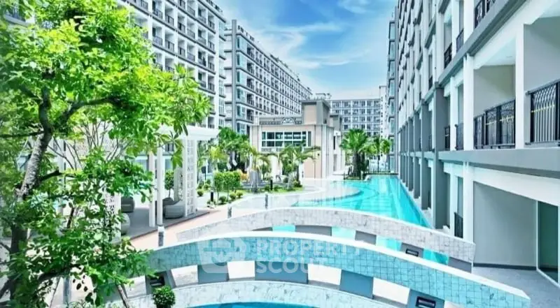 Luxurious modern apartment complex with stunning pool and lush greenery