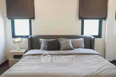 Cozy bedroom with modern decor and natural light