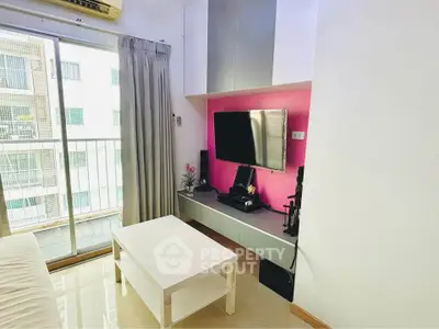 Modern living room with balcony access and sleek entertainment setup
