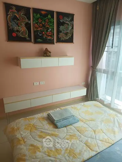 Cozy bedroom with elegant decor and large window for natural light