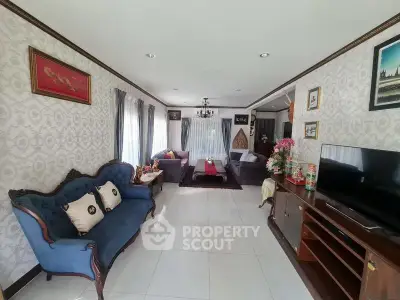 Elegant living room with classic decor and ample natural light