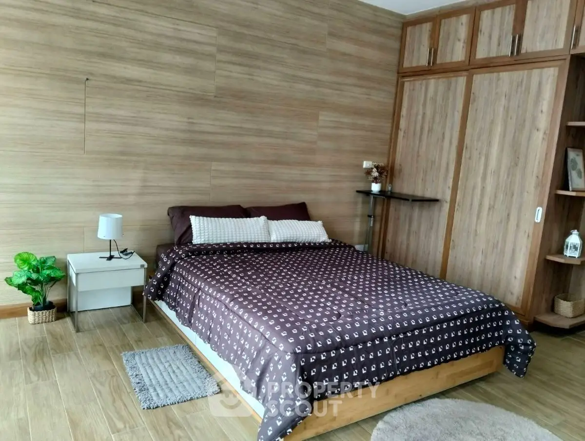 Cozy bedroom with wooden accents and modern decor