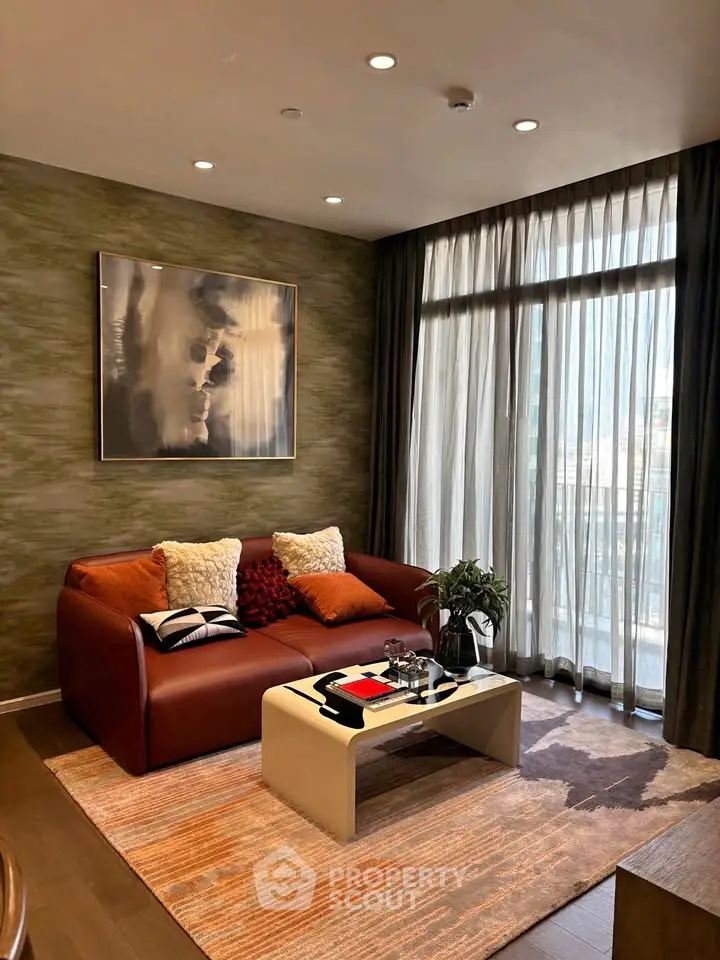 Stylish living room with modern decor, cozy sofa, and large window offering natural light.