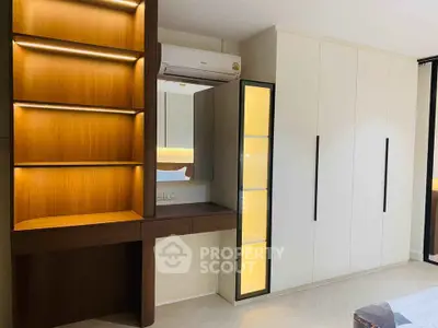 Modern bedroom with built-in wardrobe and stylish wooden shelving