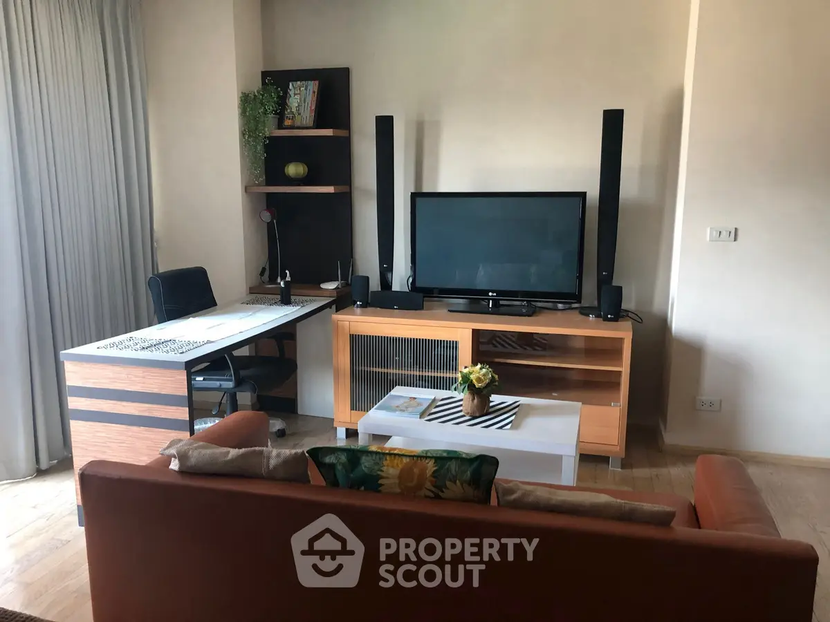 Modern living room with stylish furniture and entertainment center