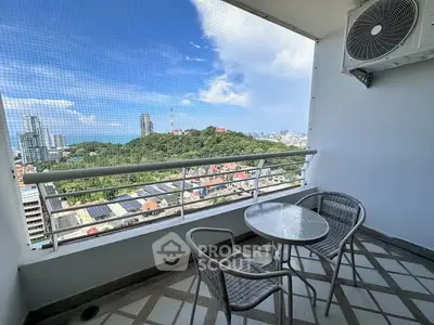 Spacious balcony with stunning city and greenery views, perfect for relaxation and enjoying the outdoors.