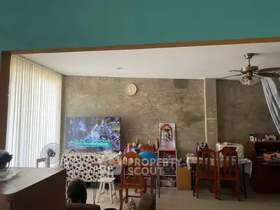 Cozy living room with modern decor and entertainment setup, perfect for relaxation and family gatherings.