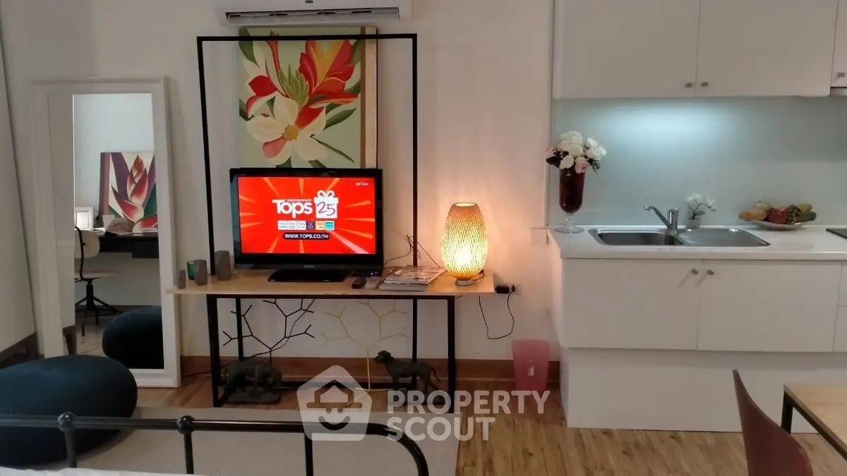 Chic studio apartment with modern decor and open kitchen layout