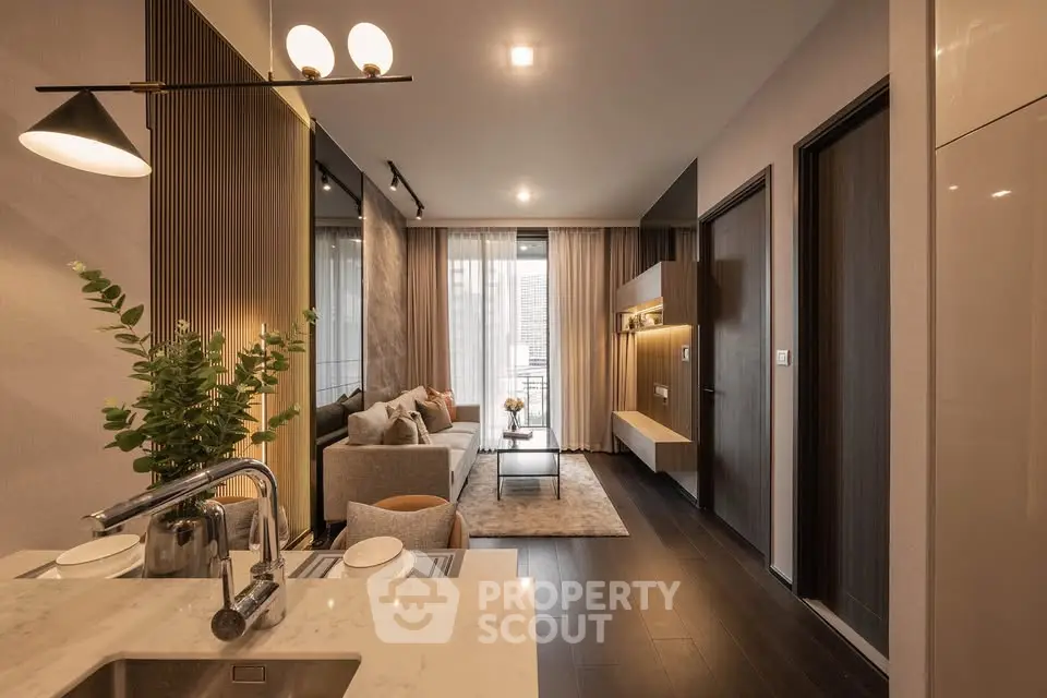 Modern open-layout living room with elegant decor and natural light
