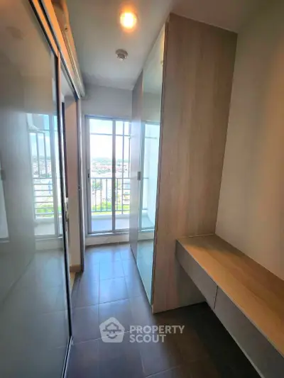 Modern apartment with sleek storage solutions and balcony view
