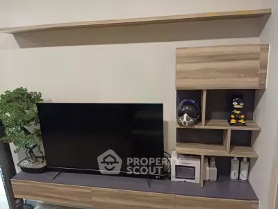 Modern living room with sleek TV unit and stylish shelving