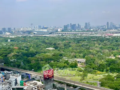 Stunning cityscape view with lush greenery and skyline, perfect for urban living enthusiasts.