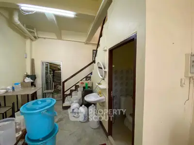 Cozy interior space with staircase and bathroom, ideal for creative renovation.