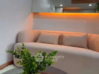 Modern living room with stylish sofa and ambient lighting