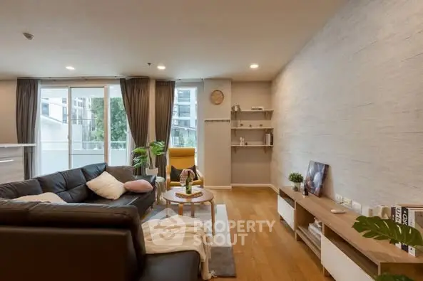 Spacious modern living room with cozy seating and natural light