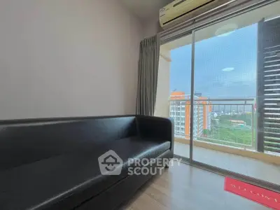 Modern living room with balcony view in high-rise apartment
