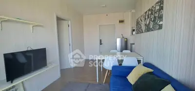 Modern living room with stylish decor and cozy seating area, perfect for relaxation and entertainment.