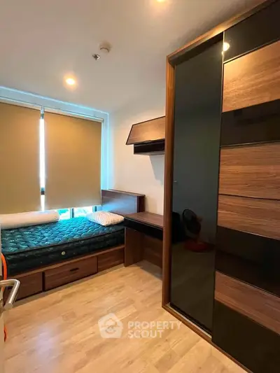 Cozy bedroom with modern wooden furniture and ample natural light