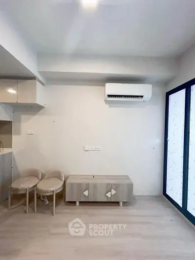 Modern minimalist living room with air conditioning and stylish furniture