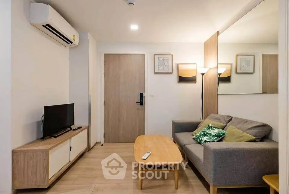 Modern living room with stylish furniture and air conditioning in a cozy apartment.