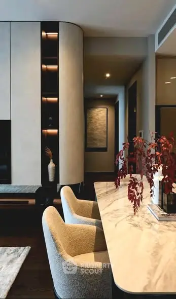 Elegant modern living room with marble table and stylish chairs