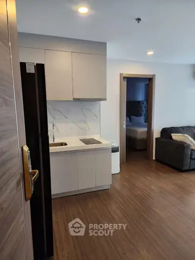 Modern apartment interior with open kitchen and cozy living area