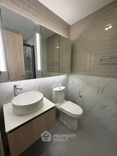 Modern bathroom with stylish vanity and elegant tile design