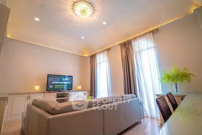 Elegant living room with modern decor, cozy seating, and ambient lighting, perfect for relaxation and entertainment.
