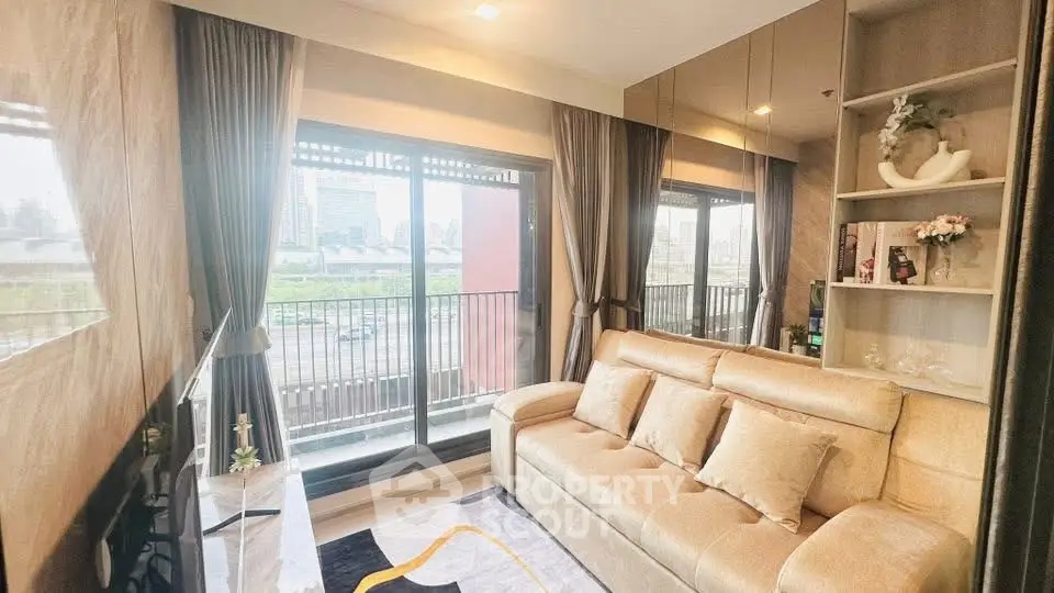 Luxurious living room with plush sofa and city view balcony, perfect for urban living.