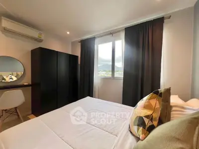 Cozy bedroom with modern decor and scenic window view